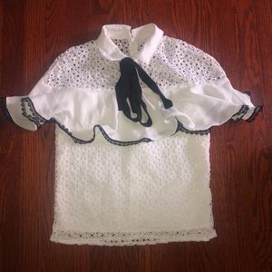 Black and white laced blouse in size xs.